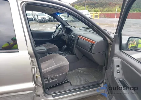 1999 Jeep Grand Cherokee Laredo из США, поврежденный, VIN 1J4GW58S1XC673530